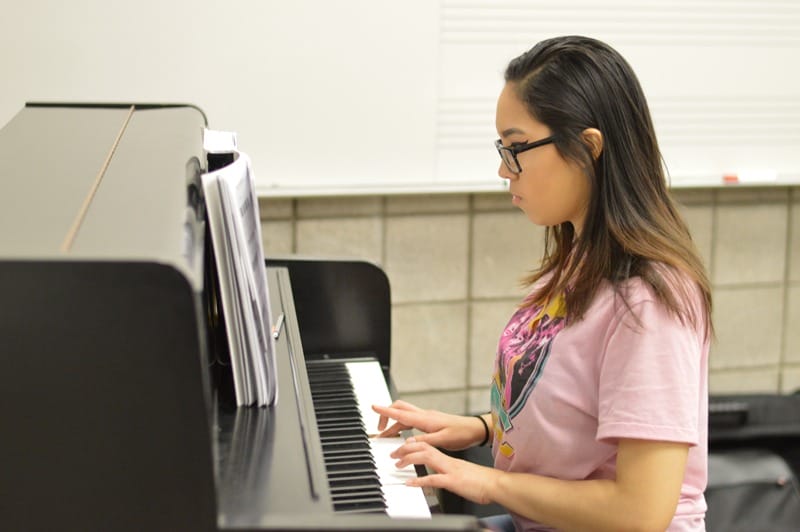 girl playing piano