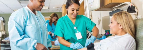 Nurse drawing blood from a patient