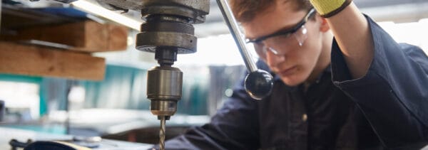 Student using drill press