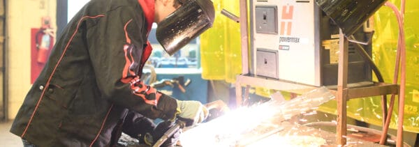 Welding student working on a project