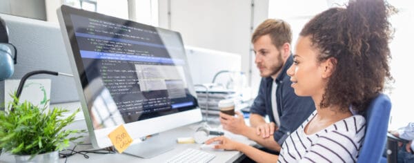 Two Students working on computer