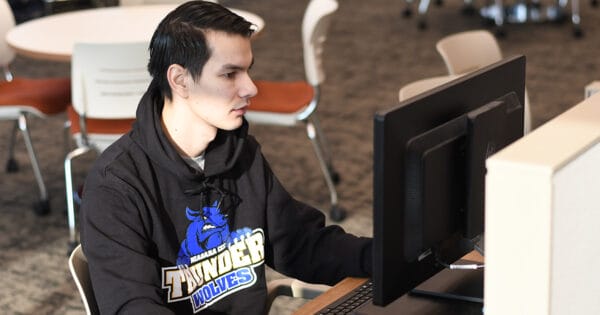 SUNY Niagara student on computer