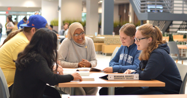 Students sitting around a table studying