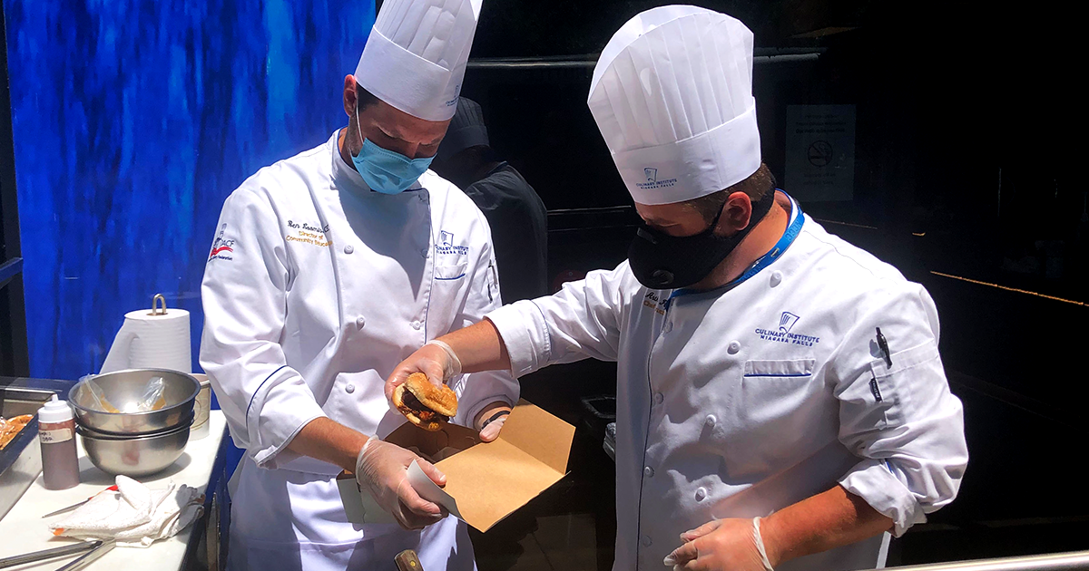 NFCI Chefs prepare freshly grilled summer food at Savor on the Street.