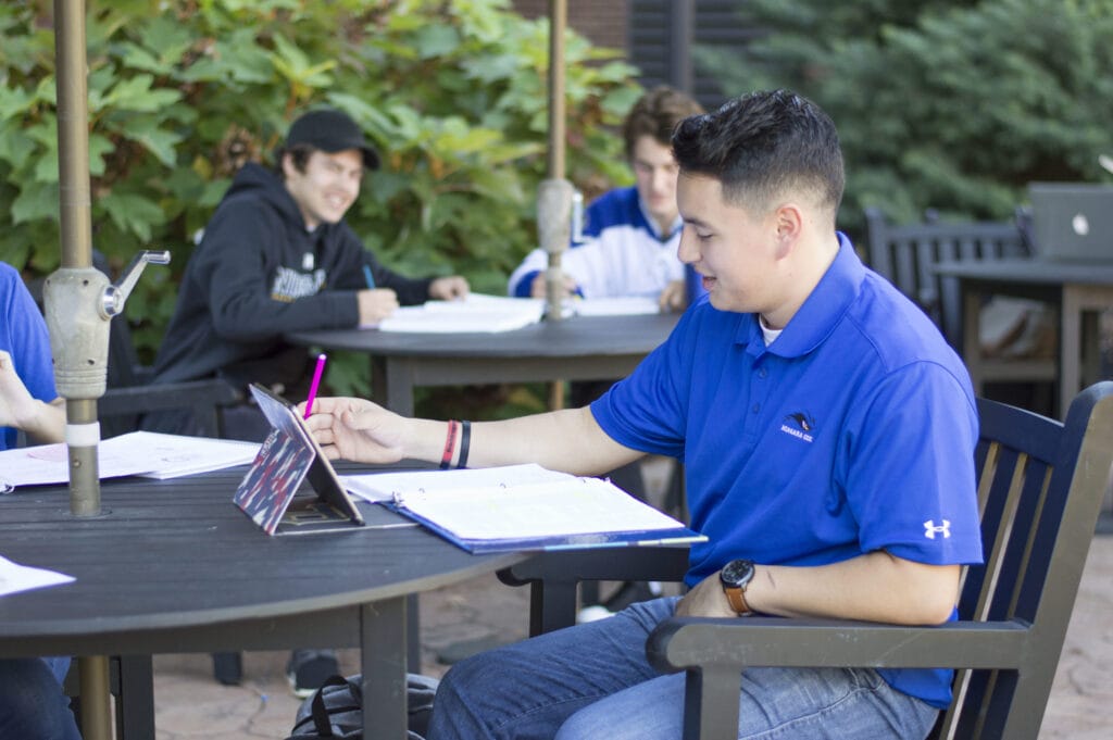 Student studding outside