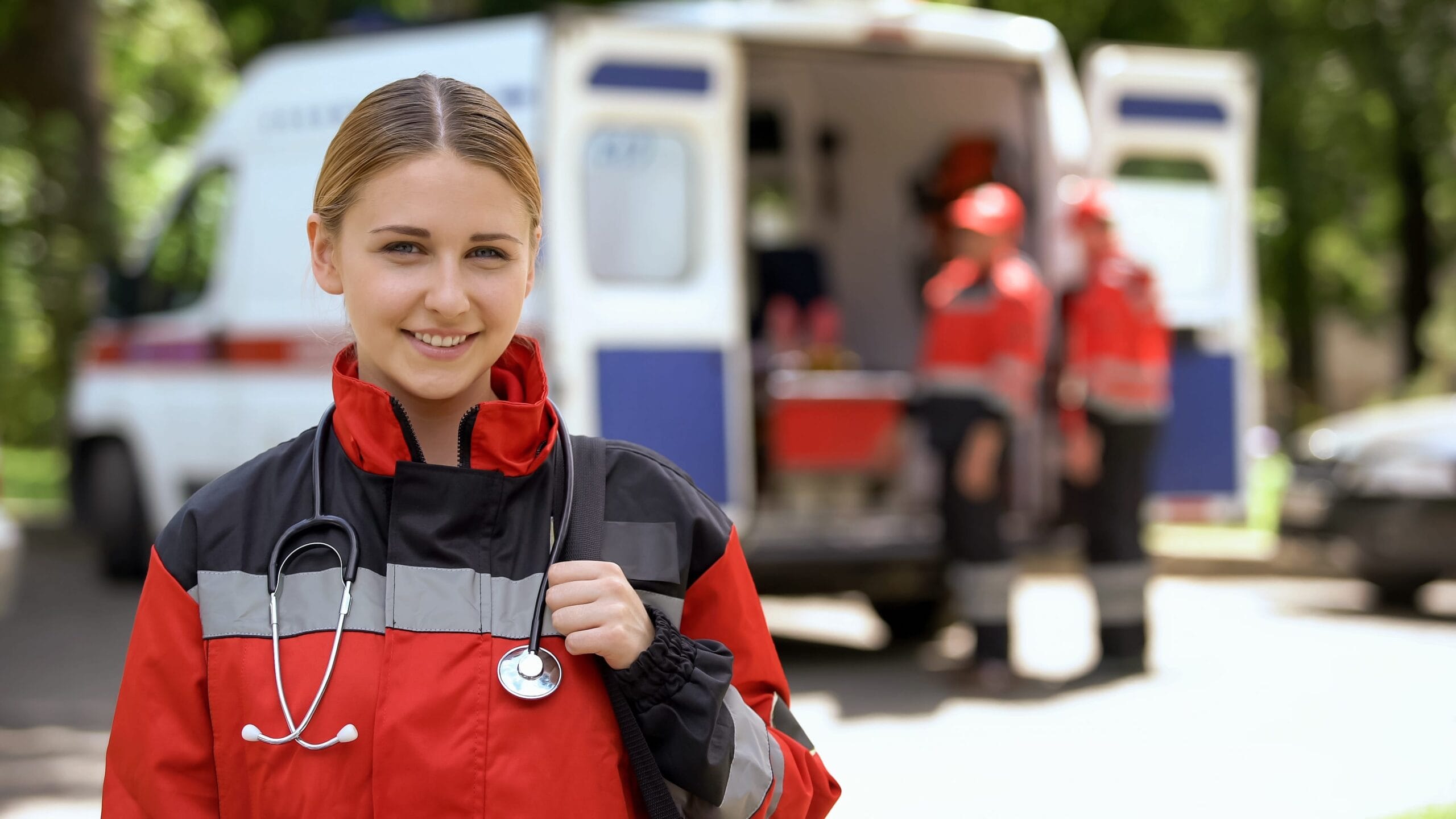 Paramedic Women in front of an ambulance