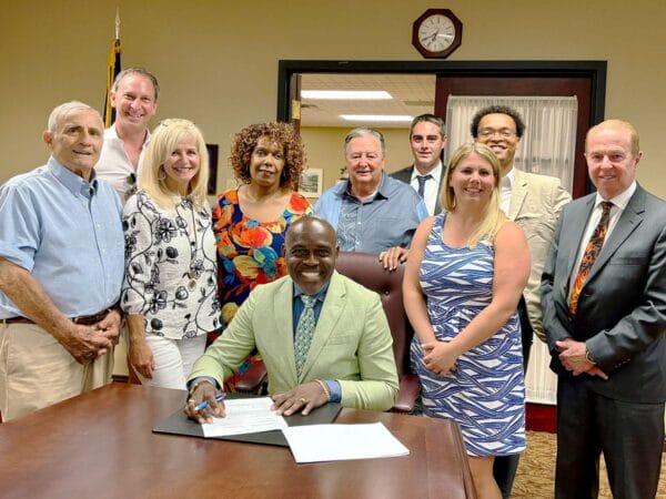 Trustees and President Signing