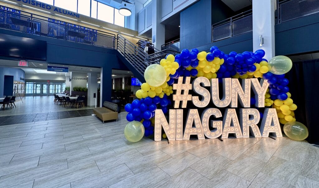 SUNY Niagara sign lit up with ballons.