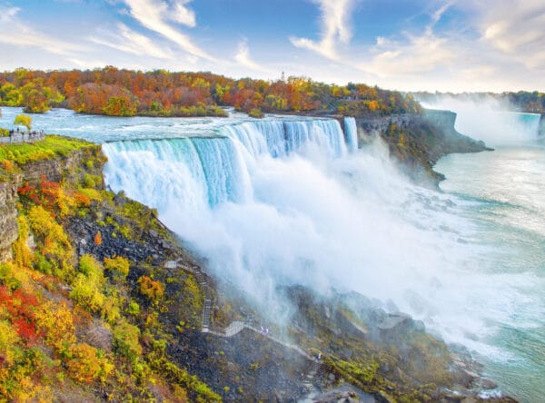 Niagara Falls including American Falls in foreground and Horseshoe Falls in background, with autumn leaf colors