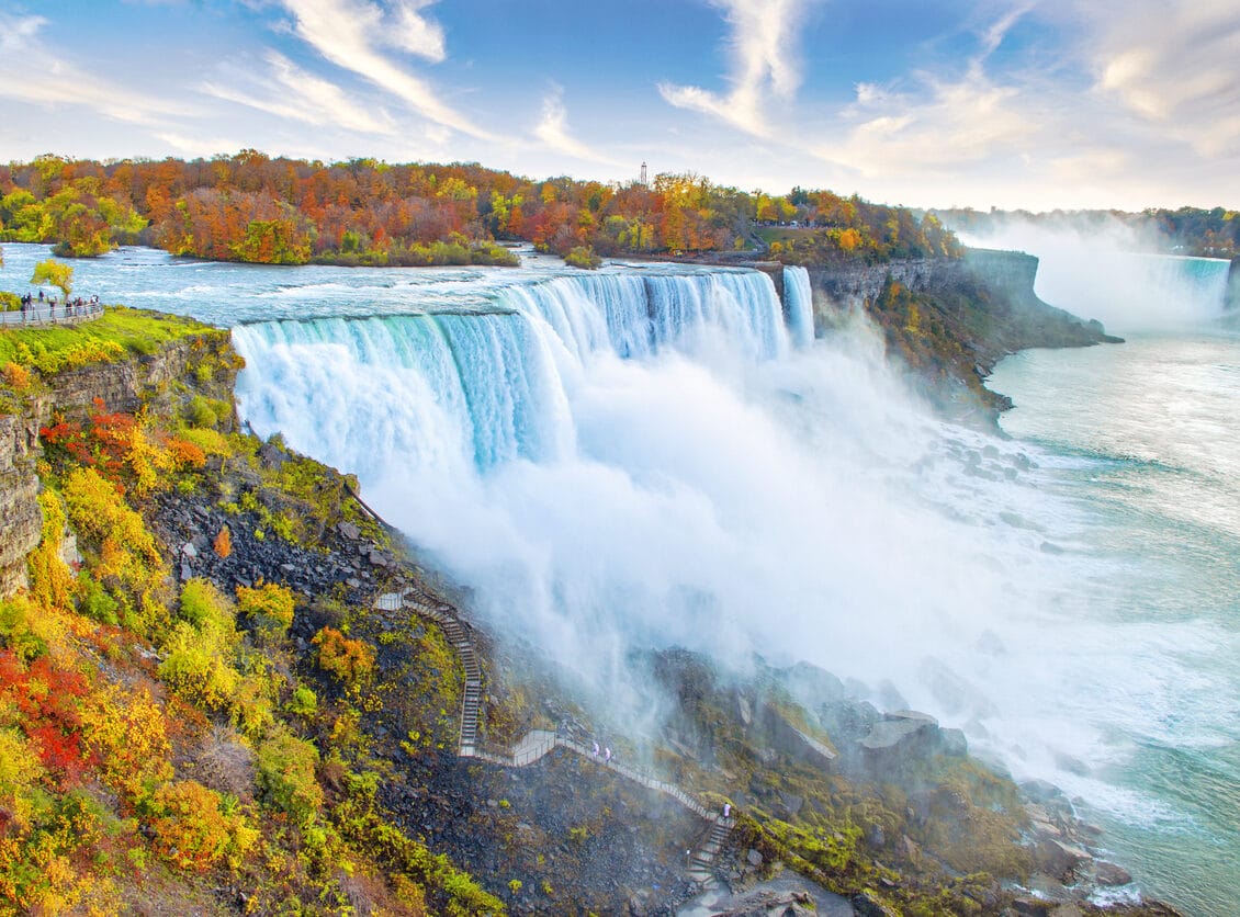 Niagara Falls including American Falls in foreground and Horseshoe Falls in background, with autumn leaf colors