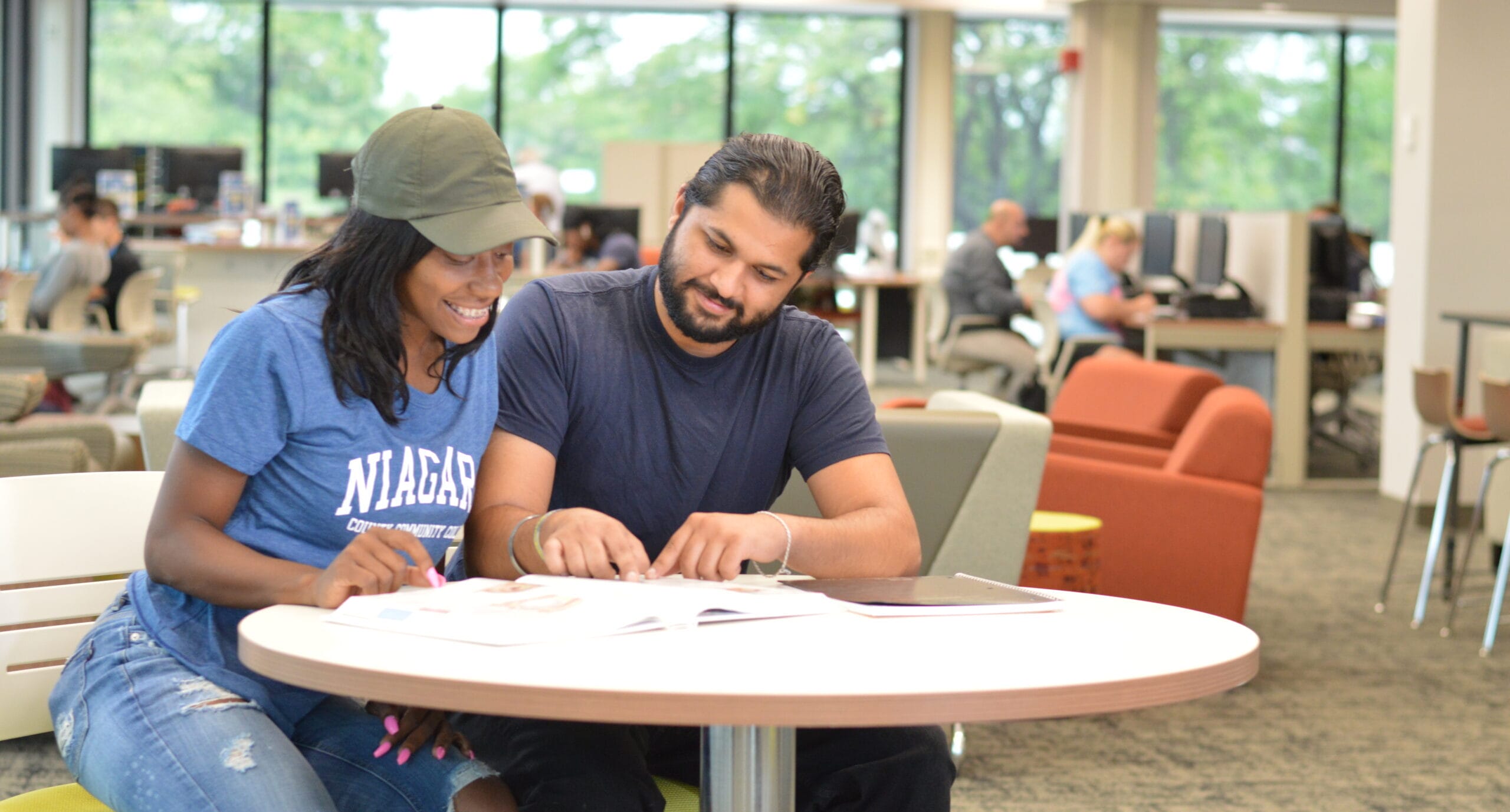 Students working at table in Academic Center for Excellence