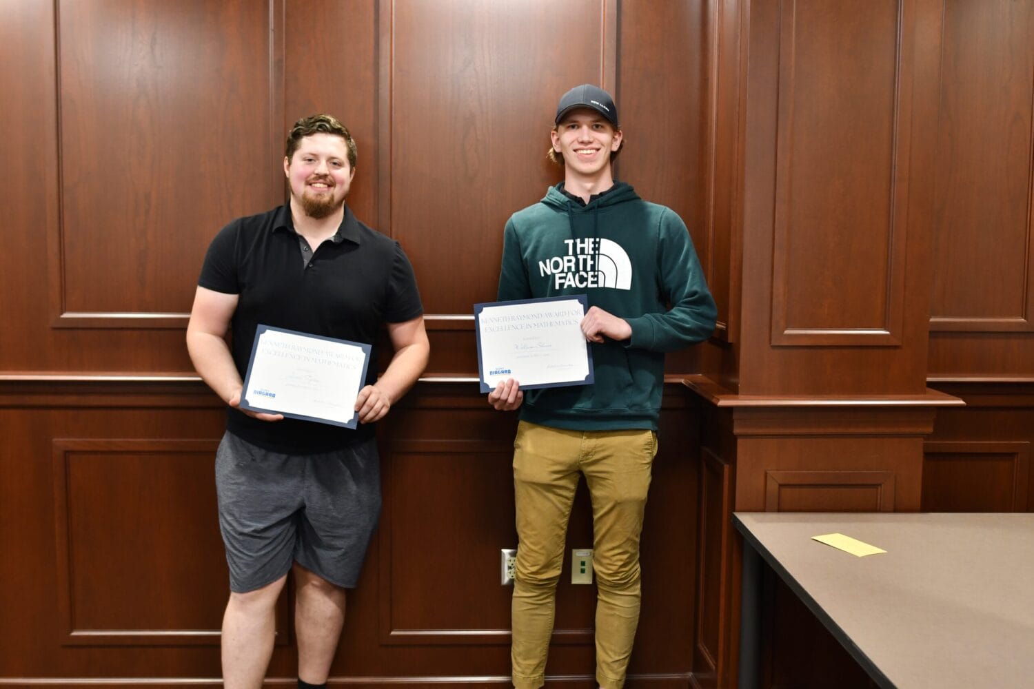 Students holding award certificates