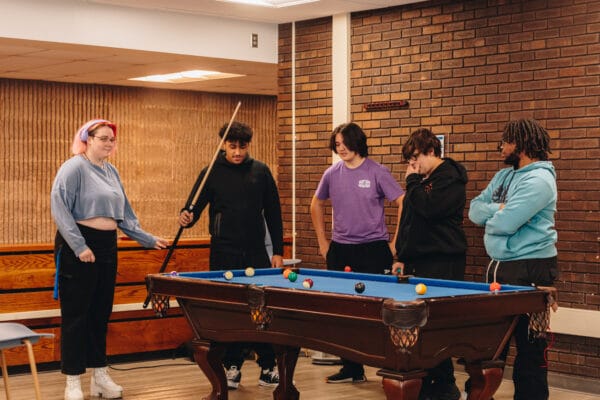 SUNY Niagara Students playing pool in the Student Hub