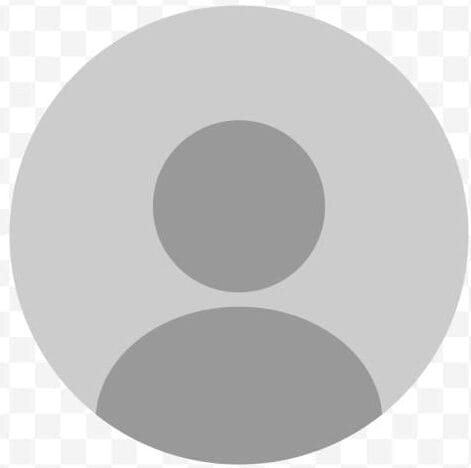 Gray circular user icon with a generic person silhouette on a transparent, checkered background. Commonly used as a placeholder profile picture.