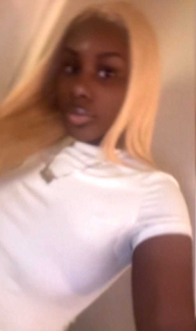 A person with blonde hair in a white top participating in the Educational Opportunity Program at SUNY Niagara.